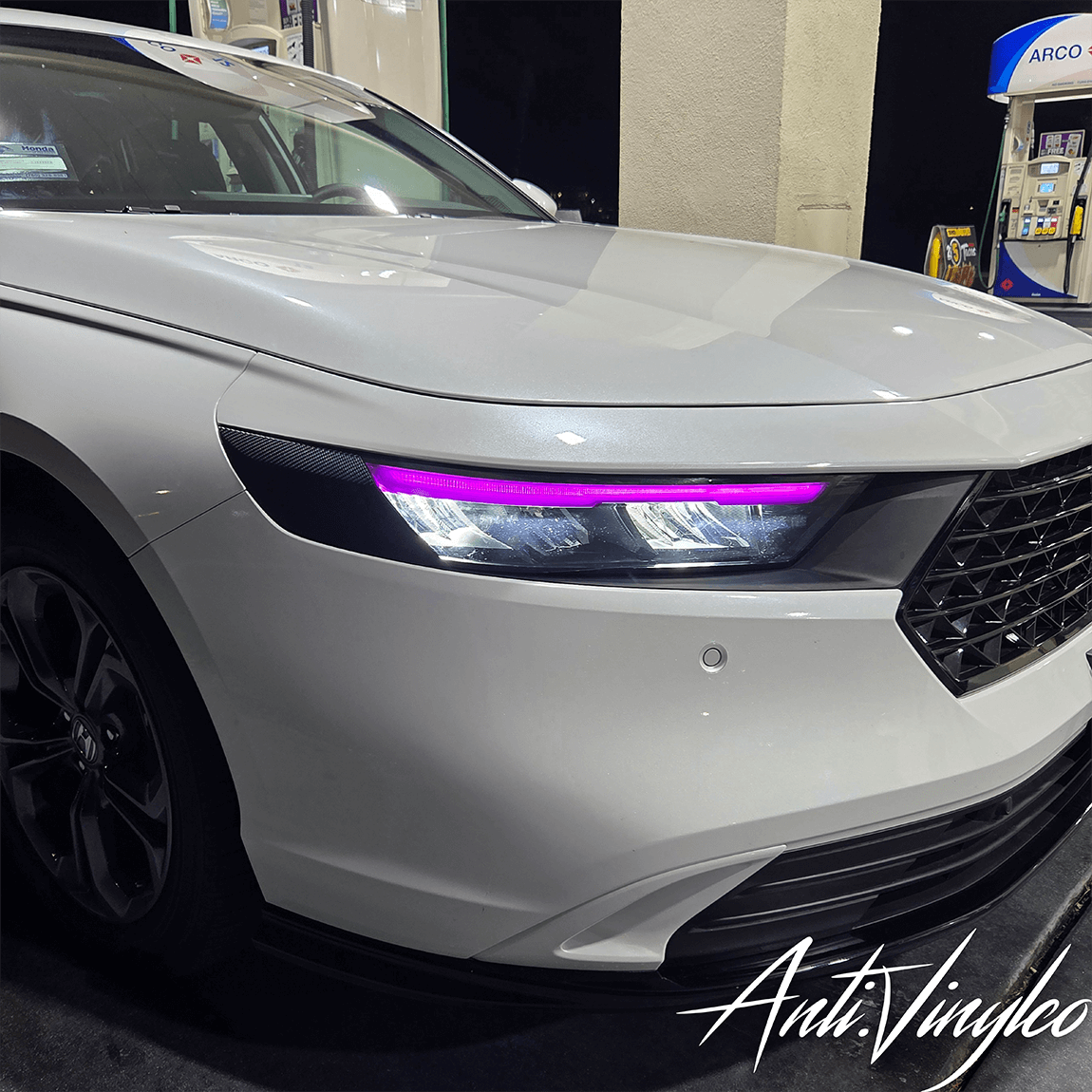 White 2023 Honda Accord with purple DRL tint for a sleek, modern look at the gas station.