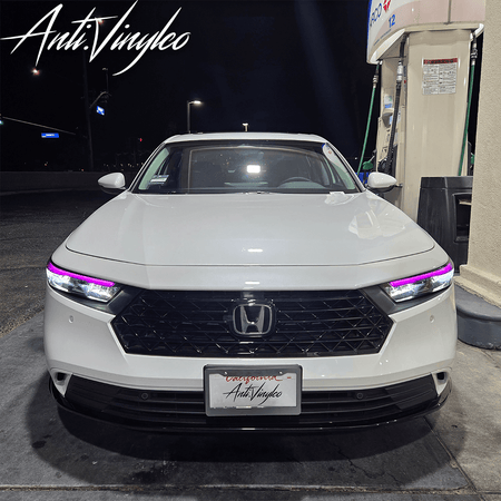 2023 Honda Accord at night showcasing sleek headlight DRL tints with stylish purple accents.