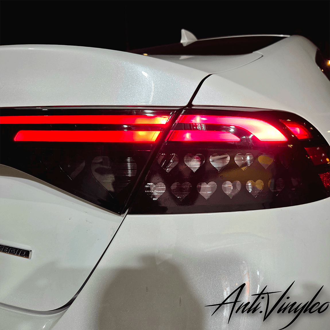 Turn signal overlays on a white Honda Accord, showcasing heart-shaped cutouts for a stylish touch.