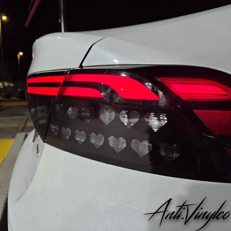 Turn signal overlays on a white Honda Accord featuring heart-shaped patterns, enhancing vehicle aesthetics.