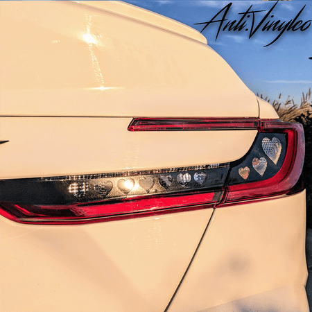 Close-up of turn signal light bar on a white 2025+ Toyota Camry with a stylish overlay design.