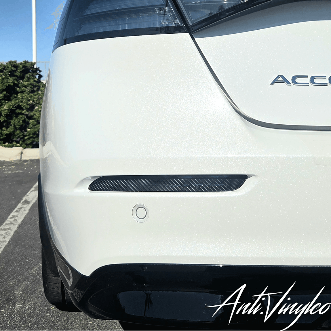 Rear view of a white 2023 Honda Accord showcasing a sleek rear reflector delete, enhancing its sporty look.