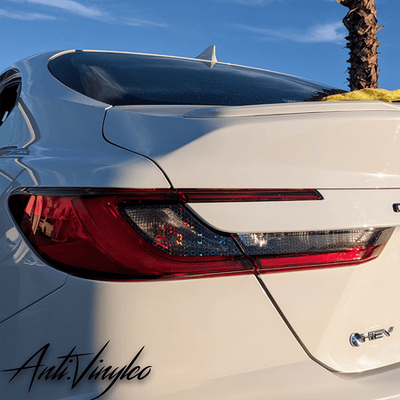 Reverse/turn signal tint set on a white 2025+ Toyota Camry, showcasing enhanced lighting visibility and sleek design.