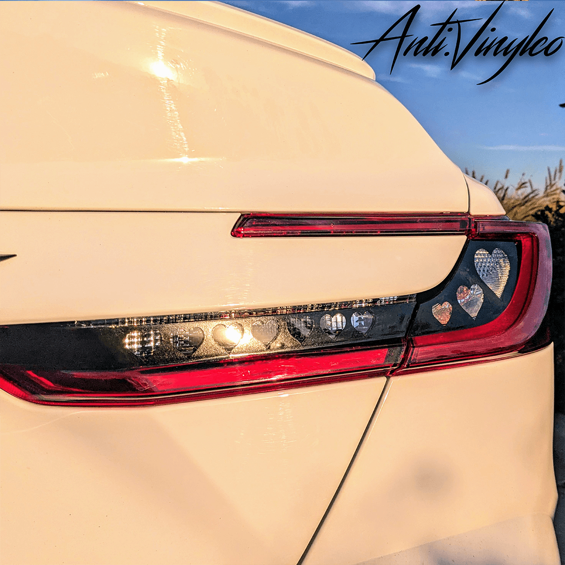 Close-up of turn signal light bar on a white 2025+ Toyota Camry with a stylish overlay design.