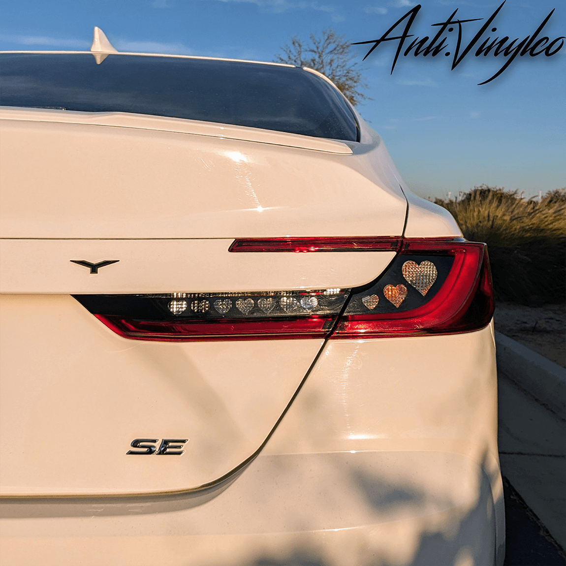 White 2025+ Toyota Camry rear view showcasing stylish turn signal overlay set with heart design.