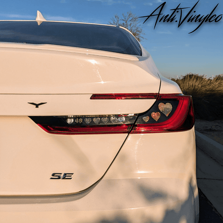 White 2025+ Toyota Camry rear view showcasing stylish turn signal overlay set with heart design.
