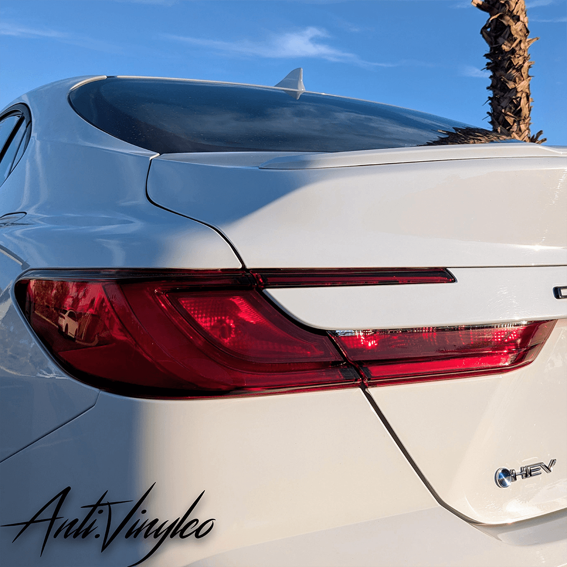 Rear view of a white 2025+ Toyota Camry showcasing reverse and turn signal tint set enhancement.