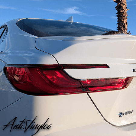 Rear view of a white 2025+ Toyota Camry showcasing reverse and turn signal tint set enhancement.